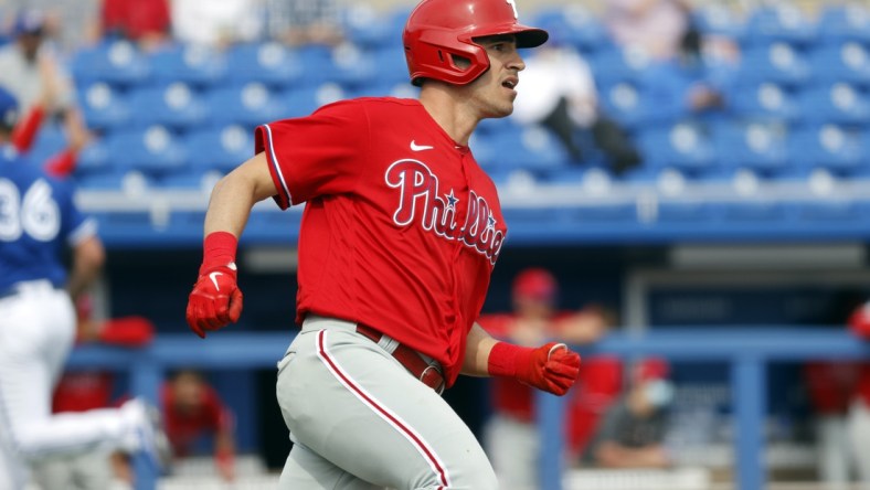 Mar 2, 2021; Dunedin, Florida, USA;  Philadelphia Phillies center fielder Adam Haseley (40) doubles during the fifth inning against the Toronto Blue Jays at TD Ballpark. Mandatory Credit: Kim Klement-USA TODAY Sports