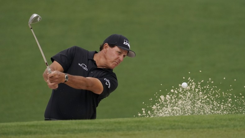 Apr 9, 2021; Augusta, Georgia, USA; Phil Mickelson hits out of a bunker on the 2nd hole during the second round of The Masters golf tournament. Mandatory Credit: Rob Schumacher-USA TODAY Sports