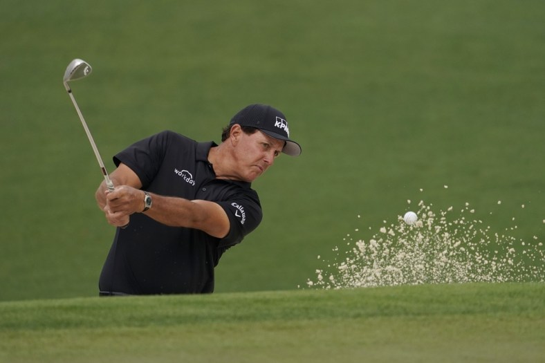 Apr 9, 2021; Augusta, Georgia, USA; Phil Mickelson hits out of a bunker on the 2nd hole during the second round of The Masters golf tournament. Mandatory Credit: Rob Schumacher-USA TODAY Sports
