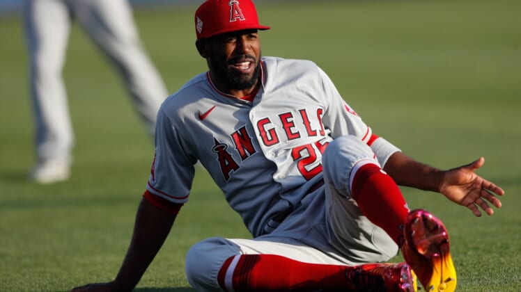 Apr 9, 2021; Dunedin, Florida, CAN;  Los Angeles Angels right fielder Dexter Fowler (25) warms up before a game against the Toronto Blue Jays at TD Ballpark. Mandatory Credit: Nathan Ray Seebeck-USA TODAY Sports