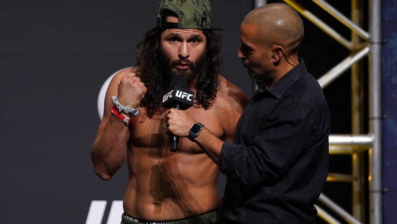 Apr 23, 2021; Jacksonville, Florida, USA; Jorge Masvidal (L) talks with UFC play-by-play commentator Jon Anik (R) during weigh-ins for UFC 261 at VyStar Veterans Memorial Arena. Mandatory Credit: Jasen Vinlove-USA TODAY Sports