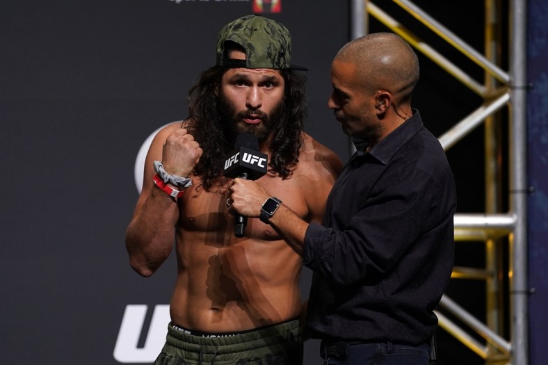 Apr 23, 2021; Jacksonville, Florida, USA; Jorge Masvidal (L) talks with UFC play-by-play commentator Jon Anik (R) during weigh-ins for UFC 261 at VyStar Veterans Memorial Arena. Mandatory Credit: Jasen Vinlove-USA TODAY Sports
