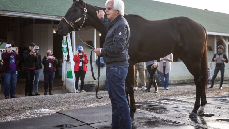 Trainer Bob Baffert holds Medina Spirit the morning after winning his seventh Kentucky Derby with the horse. One week later it was announced that Medina Spirit tested positive for an abundance of an anti-inflammatory drug following the race. April 26, 2021

Aj4t9113