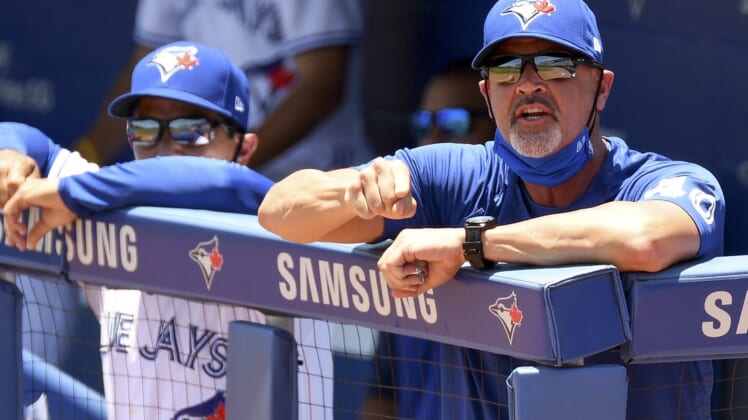 May 24, 2021; Dunedin, Florida, CAN; Toronto Blue Jays pitching coach Pete Walker (40) complains to the umpire after a bases loaded walk in the first inning against the Tampa Bay Rays . Walker was ejected.   at TD Ballpark. Mandatory Credit: Jonathan Dyer-USA TODAY Sports
