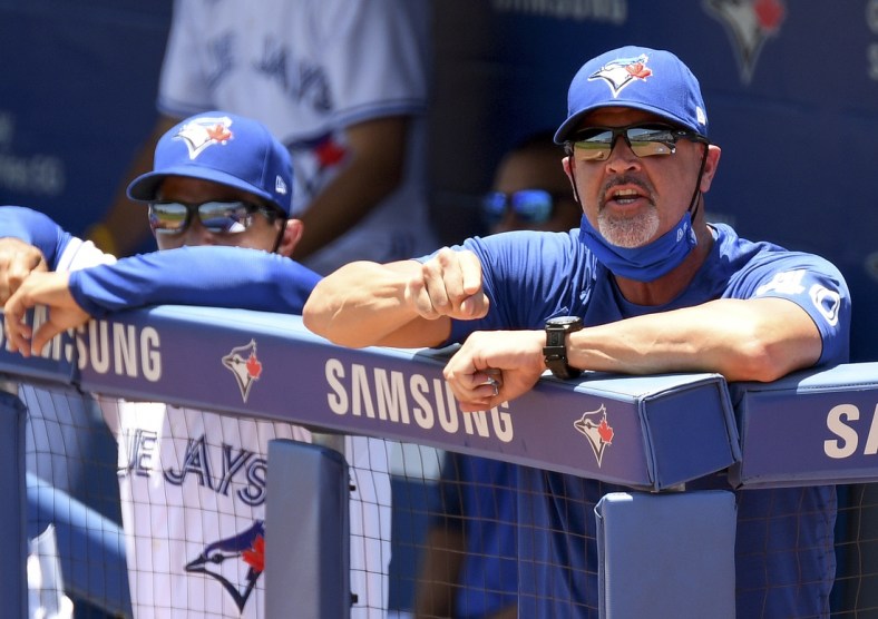 May 24, 2021; Dunedin, Florida, CAN; Toronto Blue Jays pitching coach Pete Walker (40) complains to the umpire after a bases loaded walk in the first inning against the Tampa Bay Rays . Walker was ejected.   at TD Ballpark. Mandatory Credit: Jonathan Dyer-USA TODAY Sports