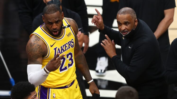 May 25, 2021; Phoenix, Arizona, USA; Los Angeles Lakers forward LeBron James (23) and assistant coach Phil Handy against the Phoenix Suns during game two of the first round of the 2021 NBA Playoffs at Phoenix Suns Arena. Mandatory Credit: Mark J. Rebilas-USA TODAY Sports