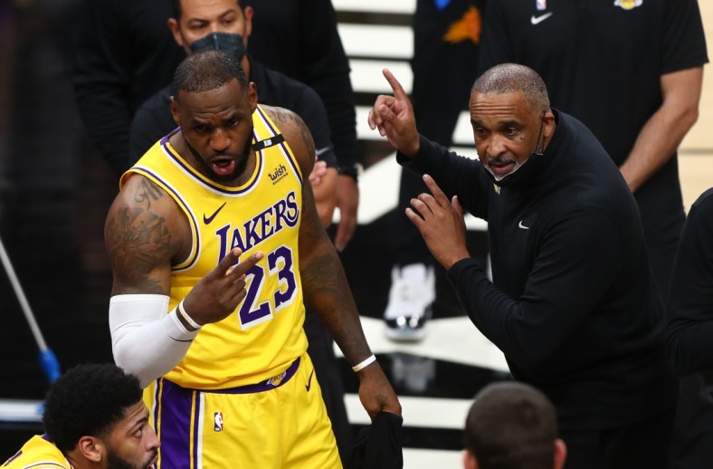 May 25, 2021; Phoenix, Arizona, USA; Los Angeles Lakers forward LeBron James (23) and assistant coach Phil Handy against the Phoenix Suns during game two of the first round of the 2021 NBA Playoffs at Phoenix Suns Arena. Mandatory Credit: Mark J. Rebilas-USA TODAY Sports