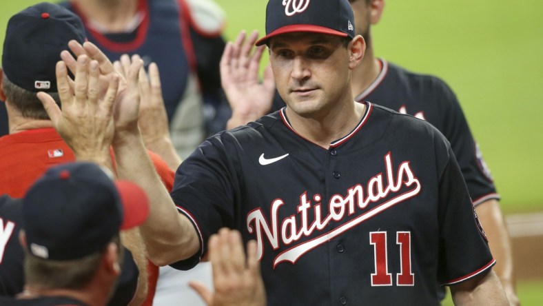 Jun 1, 2021; Atlanta, Georgia, USA; Washington Nationals first baseman Ryan Zimmerman (11) celebrates with teammates after a victory against the Atlanta Braves at Truist Park. Mandatory Credit: Brett Davis-USA TODAY Sports