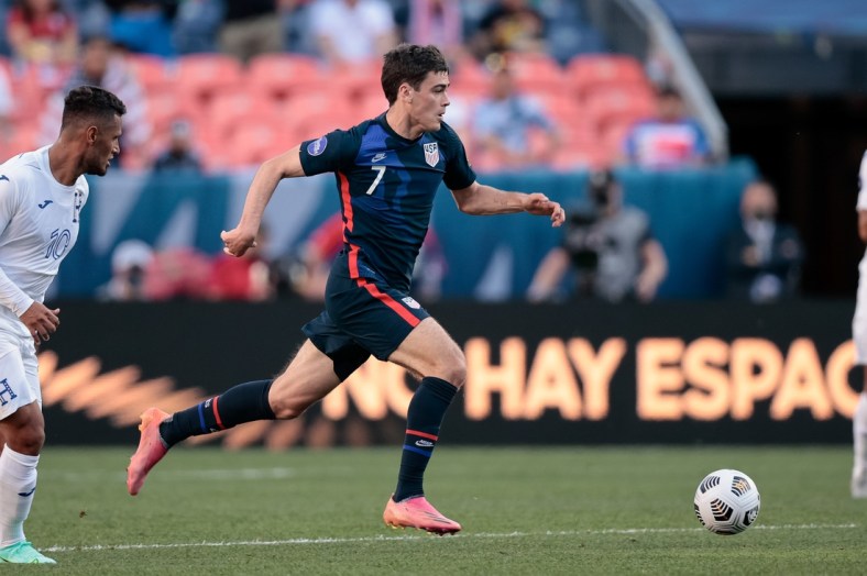 Jun 3, 2021; Denver, Colorado, USA; United States forward Gio Reyna (7) controls the ball in the first half against Honduras during the semifinals of the 2021 CONCACAF Nations League soccer series at Empower Field at Mile High. Mandatory Credit: Isaiah J. Downing-USA TODAY Sports