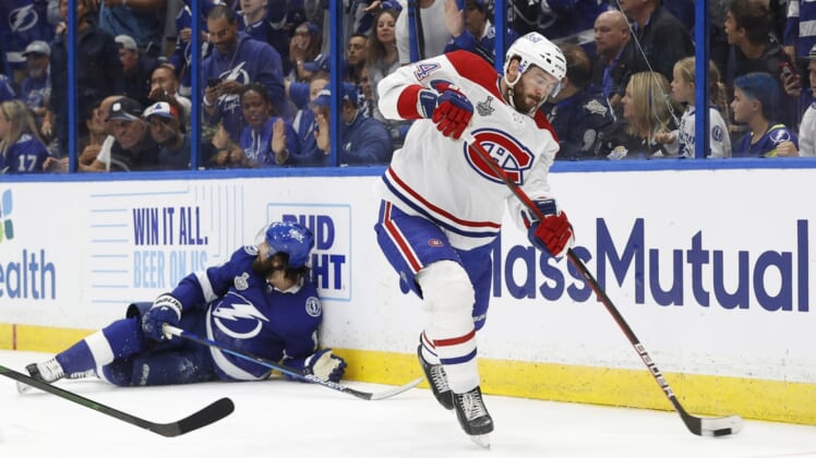 Jun 30, 2021; Tampa, Florida, USA; Montreal Canadiens defenseman Joel Edmundson (44) passes the puck against the Tampa Bay Lightning during the second period in game two of the 2021 Stanley Cup Final at Amalie Arena. Mandatory Credit: Kim Klement-USA TODAY Sports
