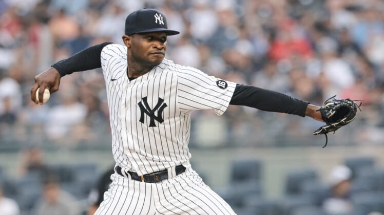 Jul 20, 2021; Bronx, New York, USA; New York Yankees starting pitcher Domingo German (55) delivers a pitch during the second inning against the Philadelphia Phillies at Yankee Stadium. Mandatory Credit: Vincent Carchietta-USA TODAY Sports