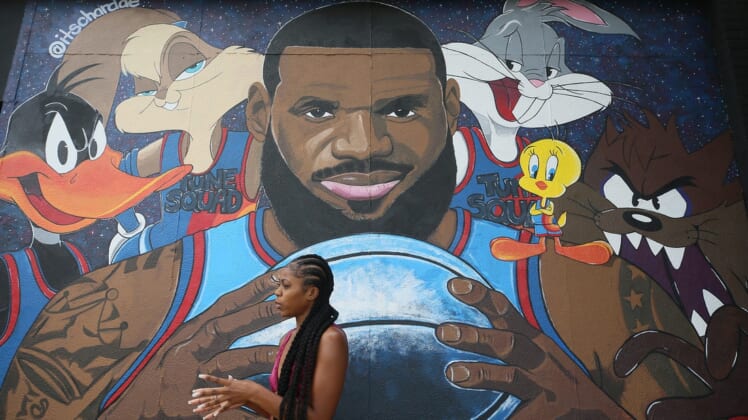 Chardae Slater, 24, a Kent State University art student, talks about painting the LeBron James "Space Jam" mural on West Market  and North Valley Street  on Wednesday July 21, 2021. The painting was Slater's first attempt at a mural.Mural 1