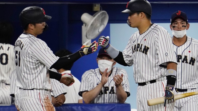 Aug 2, 2021; Yokohama, Japan; Team Japan outfielder Seiya Suzuki (51) celebrates after scoring a run against USA in a second round baseball game during the Tokyo 2020 Olympic Summer Games at Yokohama Baseball Stadium. Mandatory Credit: Mandi Wright-USA TODAY Sports