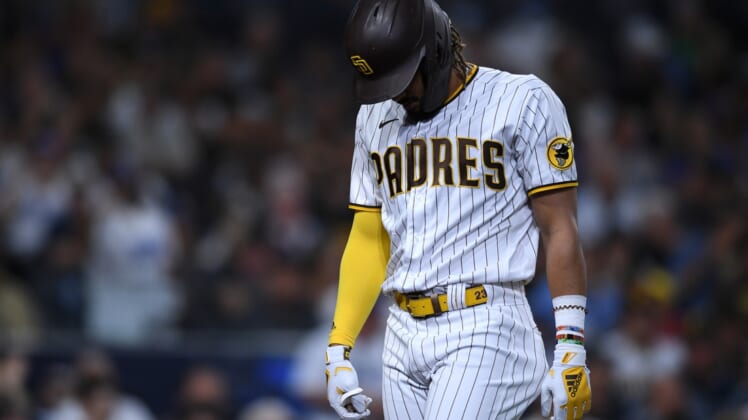 Aug 24, 2021; San Diego, California, USA; San Diego Padres center fielder Fernando Tatis Jr. (23) walks to the dugout after striking out during the fourth inning against the Los Angeles Dodgers at Petco Park. Mandatory Credit: Orlando Ramirez-USA TODAY Sports