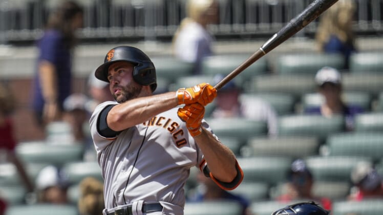 Aug 29, 2021; Cumberland, Georgia, USA; San Francisco Giants left fielder Darin Ruf (33) singles against the Atlanta Braves during the first inning at Truist Park. Mandatory Credit: Dale Zanine-USA TODAY Sports