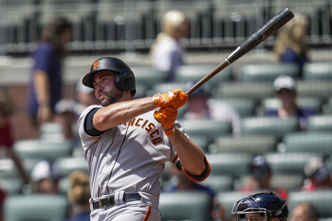 Aug 29, 2021; Cumberland, Georgia, USA; San Francisco Giants left fielder Darin Ruf (33) singles against the Atlanta Braves during the first inning at Truist Park. Mandatory Credit: Dale Zanine-USA TODAY Sports