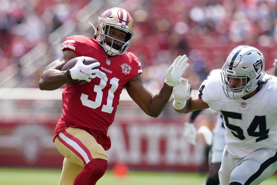 Aug 29, 2021; Santa Clara, California, USA; San Francisco 49ers running back Raheem Mostert (31) runs the ball against the Las Vegas Raiders in the first quarter at Levi's Stadium. Mandatory Credit: Cary Edmondson-USA TODAY Sports