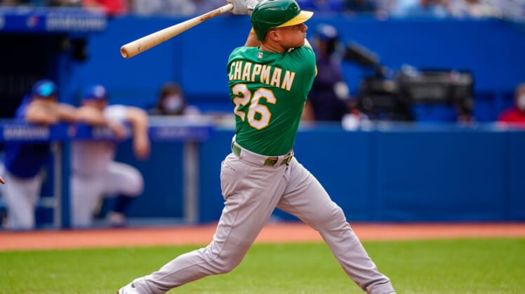 Sep 4, 2021; Toronto, Ontario, CAN; Oakland Athletics third baseman Matt Chapman (26) hits a home run against the Toronto Blue Jays during the fifth inning at Rogers Centre. Mandatory Credit: Kevin Sousa-USA TODAY Sports