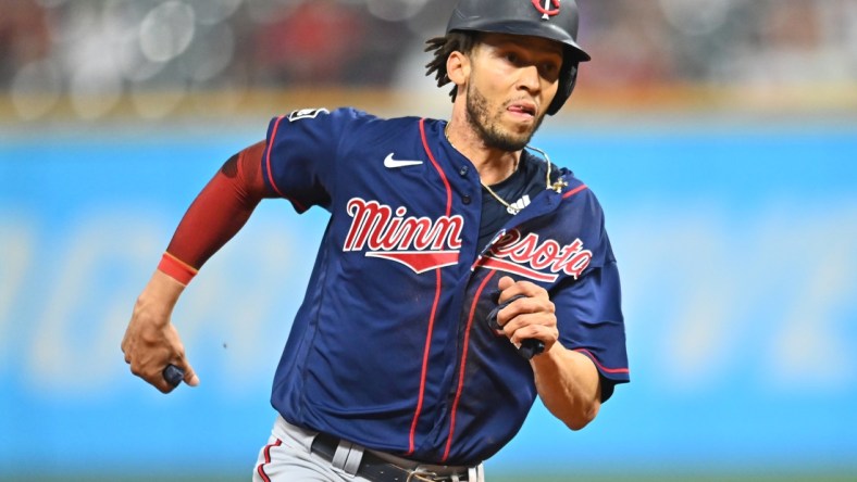 Sep 7, 2021; Cleveland, Ohio, USA; Minnesota Twins shortstop Andrelton Simmons (9) rounds third base to score during the ninth inning against the Cleveland Indians at Progressive Field. Mandatory Credit: Ken Blaze-USA TODAY Sports