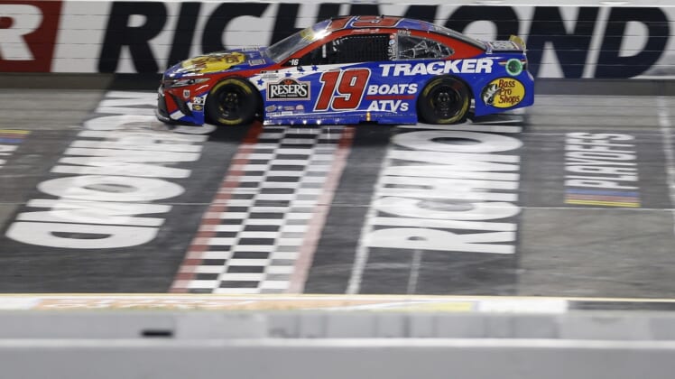 Sep 11, 2021; Richmond, Virginia, USA; NASCAR Cup Series driver Martin Truex Jr. (19) cross the finish line to win the Federated Auto Parts 400 Salute to First Responders at Richmond International Raceway. Mandatory Credit: Amber Searls-USA TODAY Sports