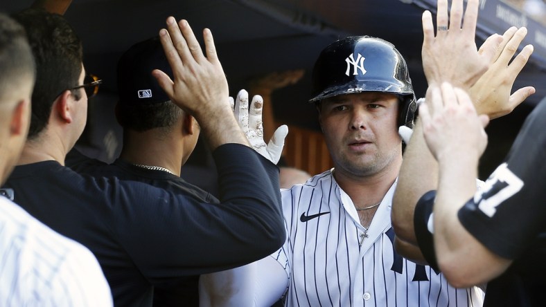 Sep 18, 2021; Bronx, New York, USA; New York Yankees first baseman Luke Voit (59) is congratulated after hitting a two run home run against the Cleveland Indians during the eighth inning at Yankee Stadium. Mandatory Credit: Andy Marlin-USA TODAY Sports