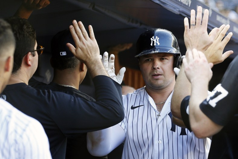 Sep 18, 2021; Bronx, New York, USA; New York Yankees first baseman Luke Voit (59) is congratulated after hitting a two run home run against the Cleveland Indians during the eighth inning at Yankee Stadium. Mandatory Credit: Andy Marlin-USA TODAY Sports