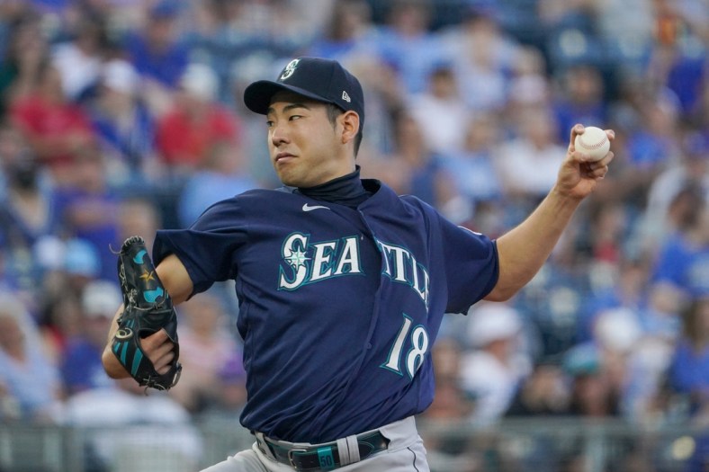 Sep 18, 2021; Kansas City, Missouri, USA; Seattle Mariners starting pitcher Yusei Kikuchi (18) delivers a pitch against the Kansas City Royals in the first inning at Kauffman Stadium. Mandatory Credit: Denny Medley-USA TODAY Sports