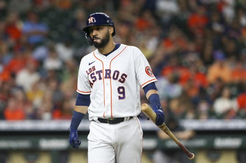 Sep 18, 2021; Houston, Texas, USA; Houston Astros designated hitter Marwin Gonzalez (9) reacts after hitting a line drive for the final out of the inning with men in scoring position against the Arizona Diamondbacks in the fourth inning at Minute Maid Park. Mandatory Credit: Thomas Shea-USA TODAY Sports