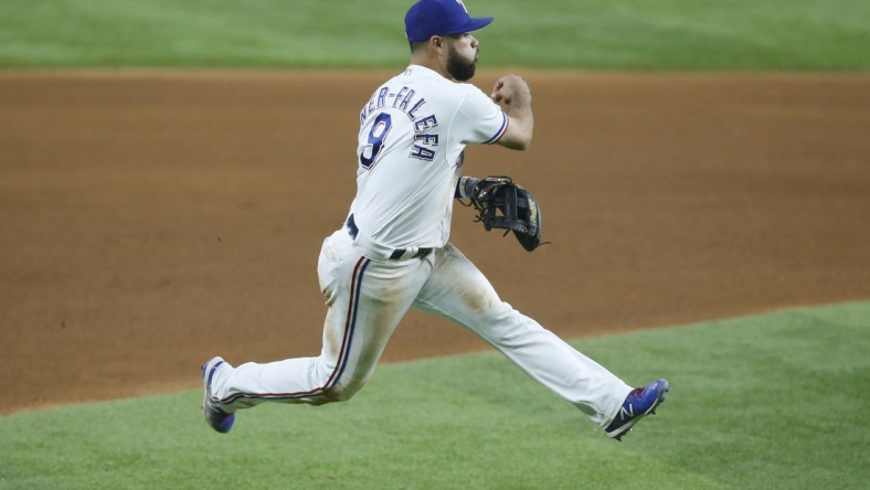 Sep 18, 2021; Arlington, Texas, USA; Texas Rangers shortstop Isiah Kiner-Falefa (9) throws to first base in the seventh inning against the Chicago White Sox at Globe Life Field. Mandatory Credit: Tim Heitman-USA TODAY Sports