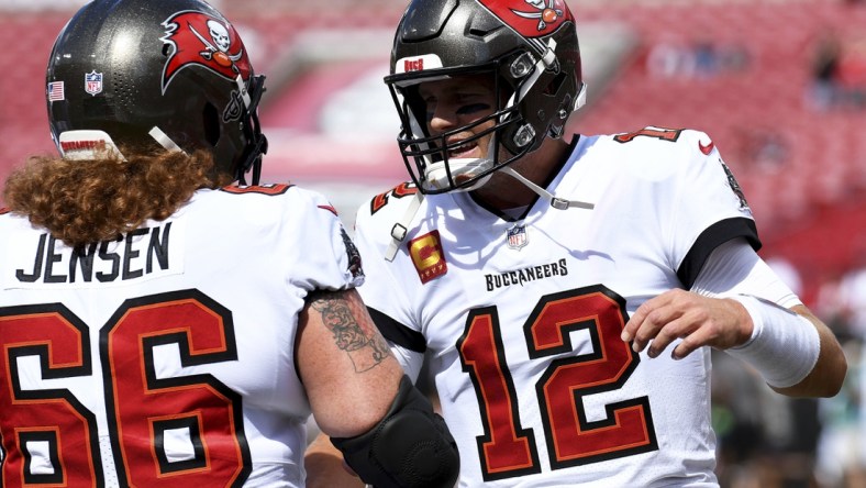 Sep 19, 2021; Tampa, Florida, USA; Tampa Bay Buccaneers quarterback Tom Brady (12) greets center Ryan Jensen (66) before the start of the game against the  Atlanta Falcons  at Raymond James Stadium. Mandatory Credit: Jonathan Dyer-USA TODAY Sports