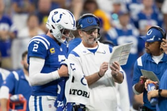 Sep 19, 2021; Indianapolis, Indiana, USA; Indianapolis Colts head coach Frank Reich talks with quarterback Carson Wentz (2) during a timeout in the second half against the Los Angeles Rams at Lucas Oil Stadium. Mandatory Credit: Trevor Ruszkowski-USA TODAY Sports