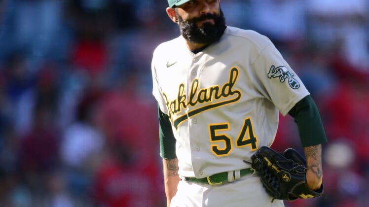 Sep 19, 2021; Anaheim, California, USA; Oakland Athletics relief pitcher Sergio Romo (54) reacts after being pulled against the Los Angeles Angels during the ninth inning at Angel Stadium. Mandatory Credit: Gary A. Vasquez-USA TODAY Sports