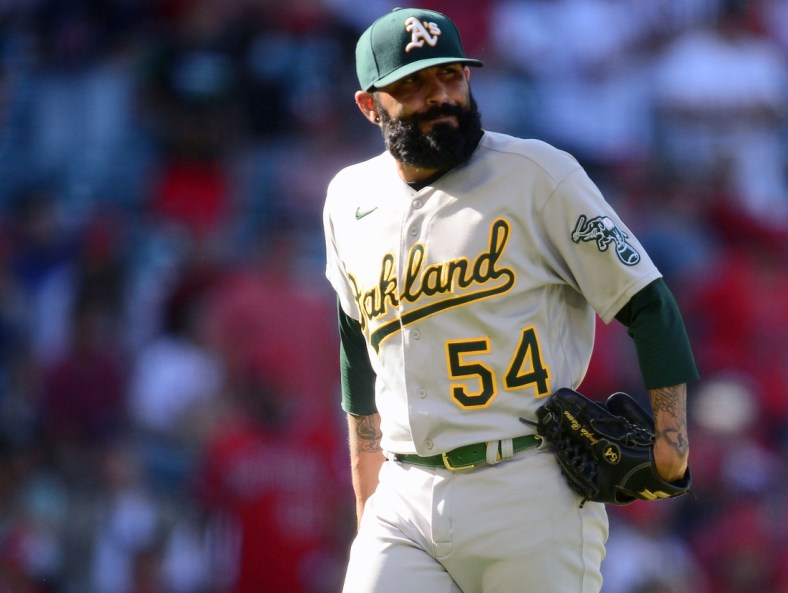 Sep 19, 2021; Anaheim, California, USA; Oakland Athletics relief pitcher Sergio Romo (54) reacts after being pulled against the Los Angeles Angels during the ninth inning at Angel Stadium. Mandatory Credit: Gary A. Vasquez-USA TODAY Sports