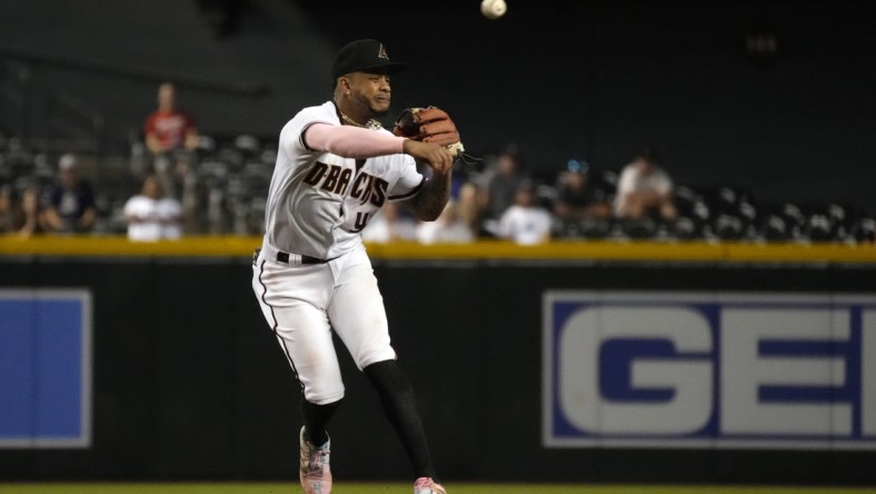 Sep 20, 2021; Phoenix, Arizona, USA; Arizona Diamondbacks second baseman Ketel Marte (4) makes an off balance throw for an out against the Atlanta Braves in the fifth inning at Chase Field. Mandatory Credit: Rick Scuteri-USA TODAY Sports