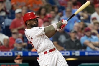 Sep 21, 2021; Philadelphia, Pennsylvania, USA; Philadelphia Phillies center fielder Andrew McCutchen (22) hits a single against the Baltimore Orioles during the fourth inning at Citizens Bank Park. Mandatory Credit: Bill Streicher-USA TODAY Sports