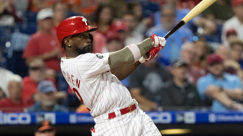 Sep 21, 2021; Philadelphia, Pennsylvania, USA; Philadelphia Phillies center fielder Andrew McCutchen (22) hits a single against the Baltimore Orioles during the fourth inning at Citizens Bank Park. Mandatory Credit: Bill Streicher-USA TODAY Sports