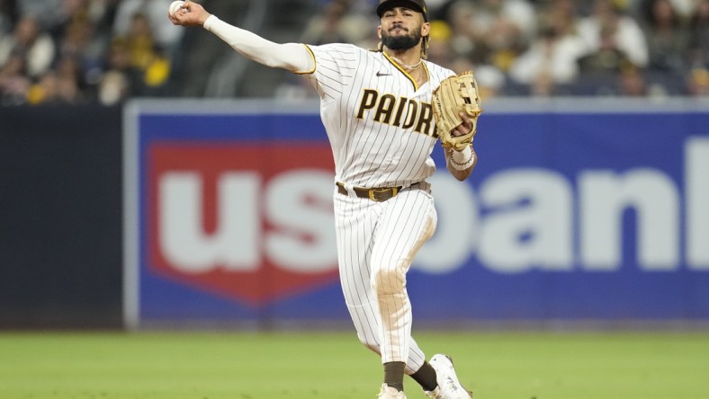 Sep 24, 2021; San Diego, California, USA;  San Diego Padres shortstop Fernando Tatis Jr. (23) throws to first base against the Atlanta Braves during the fifth inning at Petco Park. Mandatory Credit: Ray Acevedo-USA TODAY Sports