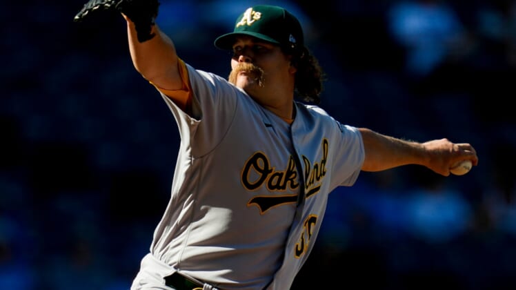 Sep 16, 2021; Kansas City, Missouri, USA; Oakland Athletics relief pitcher Andrew Chafin (39) pitches against the Kansas City Royals during the eighth inning at Kauffman Stadium. Mandatory Credit: Jay Biggerstaff-USA TODAY Sports