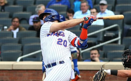 Sep 28, 2021; New York City, New York, USA; New York Mets first baseman Pete Alonso (20) singles against the Miami Marlins during the first inning of game one of a doubleheader at Citi Field. Mandatory Credit: Andy Marlin-USA TODAY Sports