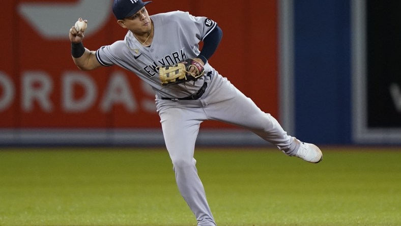 Sep 28, 2021; Toronto, Ontario, CAN; New York Yankees shortstop Gio Urshela (29) goes to throw out Toronto Blue Jays first baseman Vladimir Guerrero Jr (not pictured) at second base during the sixth inning at Rogers Centre. Mandatory Credit: John E. Sokolowski-USA TODAY Sports