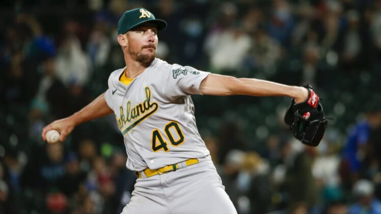 Sep 28, 2021; Seattle, Washington, USA; Oakland Athletics starting pitcher Chris Bassitt (40) throws against the Seattle Mariners during the third inning at T-Mobile Park. Mandatory Credit: Joe Nicholson-USA TODAY Sports