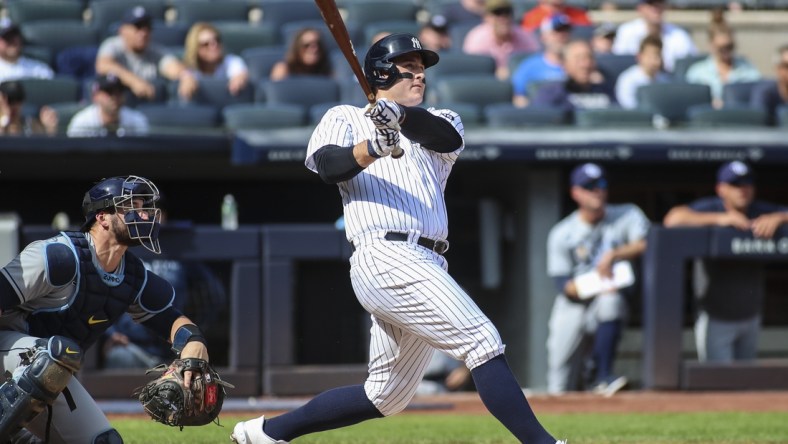 Oct 2, 2021; Bronx, New York, USA;  New York Yankees first baseman Anthony Rizzo (48) hits a solo home run in the first inning against the Tampa Bay Rays at Yankee Stadium. Mandatory Credit: Wendell Cruz-USA TODAY Sports