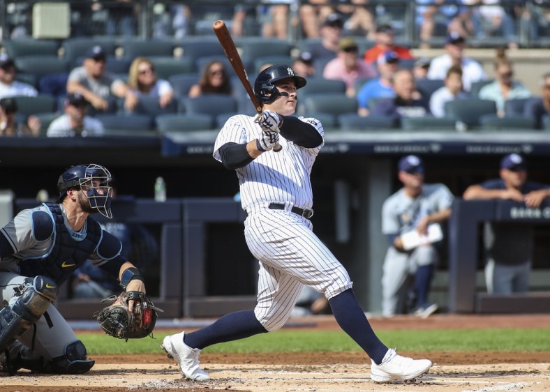 Oct 2, 2021; Bronx, New York, USA;  New York Yankees first baseman Anthony Rizzo (48) hits a solo home run in the first inning against the Tampa Bay Rays at Yankee Stadium. Mandatory Credit: Wendell Cruz-USA TODAY Sports