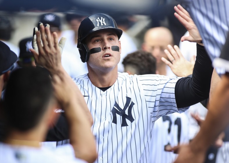 Oct 2, 2021; Bronx, New York, USA;  New York Yankees first baseman Anthony Rizzo (48) is greeted in the dugout after hitting a solo home run in the first inning against the Tampa Bay Rays at Yankee Stadium. Mandatory Credit: Wendell Cruz-USA TODAY Sports