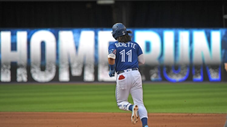 Oct 2, 2021; Toronto, Ontario, CAN;  Toronto Blue Jays shortstop Bo Bichette (11) rounds the bases after hitting a solo home run against Baltimore Orioles in the fifth inning at Rogers Centre. Mandatory Credit: Dan Hamilton-USA TODAY Sports