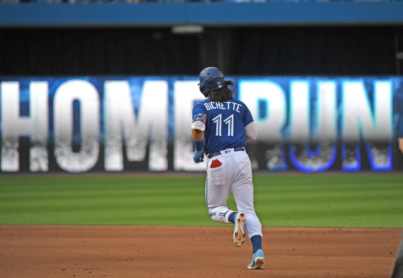 Oct 2, 2021; Toronto, Ontario, CAN;  Toronto Blue Jays shortstop Bo Bichette (11) rounds the bases after hitting a solo home run against Baltimore Orioles in the fifth inning at Rogers Centre. Mandatory Credit: Dan Hamilton-USA TODAY Sports