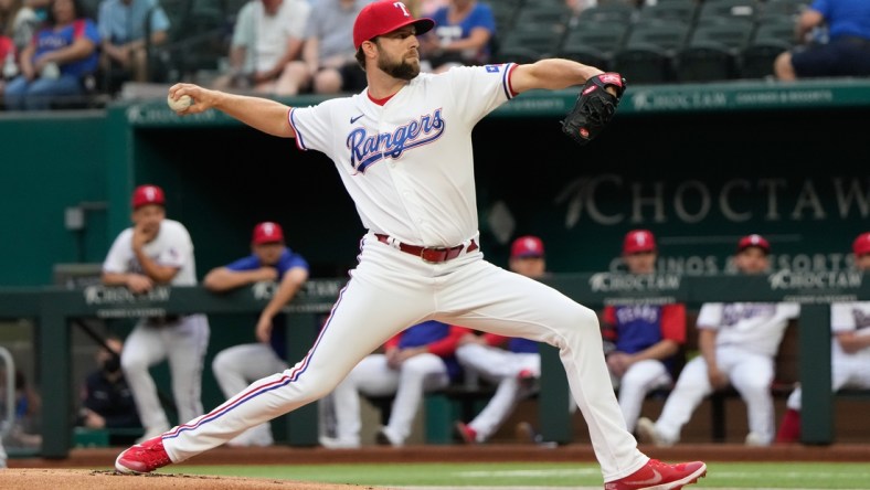 Oct 2, 2021; Arlington, Texas, USA; Texas Rangers starting pitcher Jordan Lyles (24) throws a pitch to the Cleveland Indians during the first inning at Globe Life Field. Mandatory Credit: Jim Cowsert-USA TODAY Sports