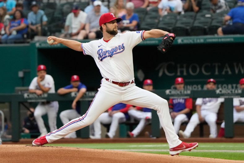Oct 2, 2021; Arlington, Texas, USA; Texas Rangers starting pitcher Jordan Lyles (24) throws a pitch to the Cleveland Indians during the first inning at Globe Life Field. Mandatory Credit: Jim Cowsert-USA TODAY Sports
