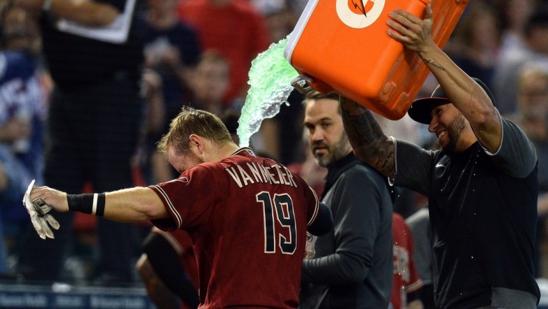 Oct 3, 2021; Phoenix, Arizona, USA; Arizona Diamondbacks left fielder David Peralta douses Arizona Diamondbacks second baseman Josh VanMeter (19) after a walk-off home run against the Colorado Rockies during the ninth inning at Chase Field. Mandatory Credit: Joe Camporeale-USA TODAY Sports