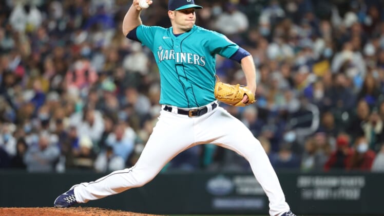 Oct 1, 2021; Seattle, Washington, USA;  Seattle Mariners relief pitcher Casey Sadler (65) pitches against the Los Angeles Angels during the seventh inning at T-Mobile Park. Mandatory Credit: Abbie Parr-USA TODAY Sports